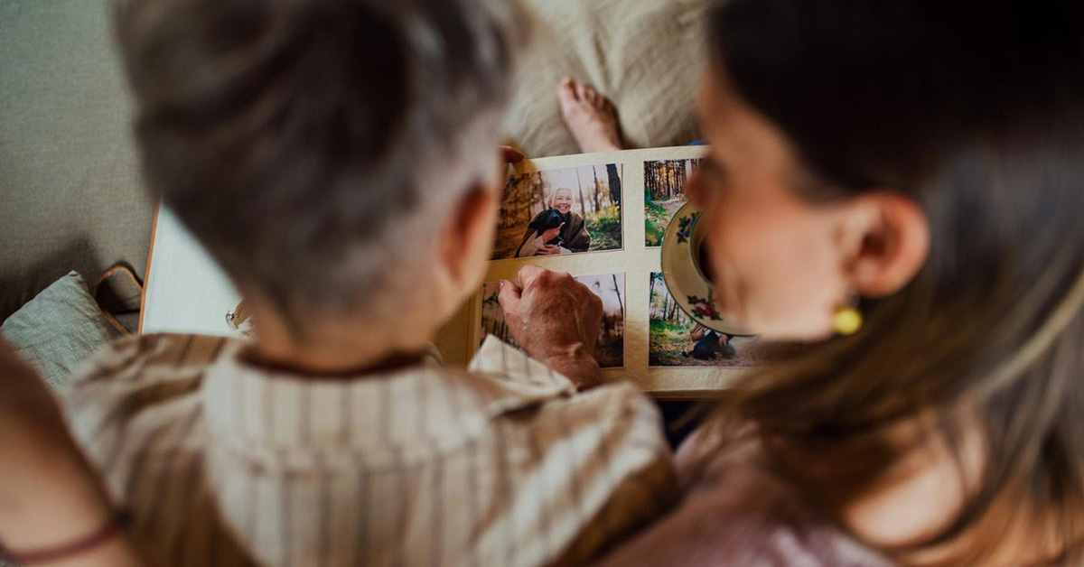 family looking at photo album together