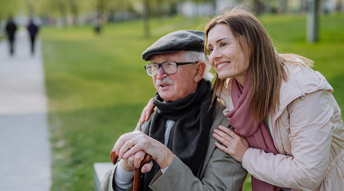 a happy senior with his adult daughter